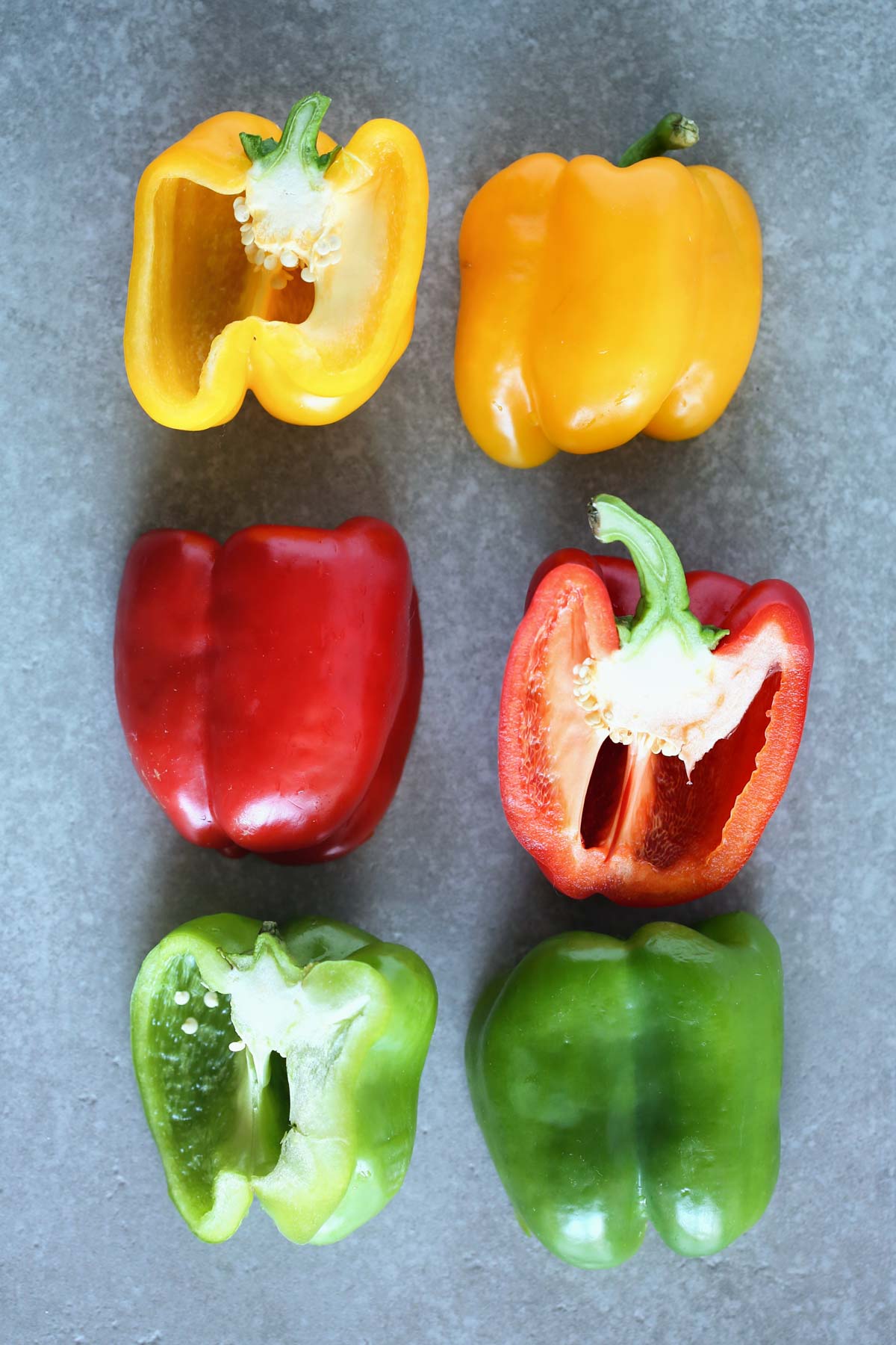 Bell peppers cut in half alternating colors. Yellow, red then green.